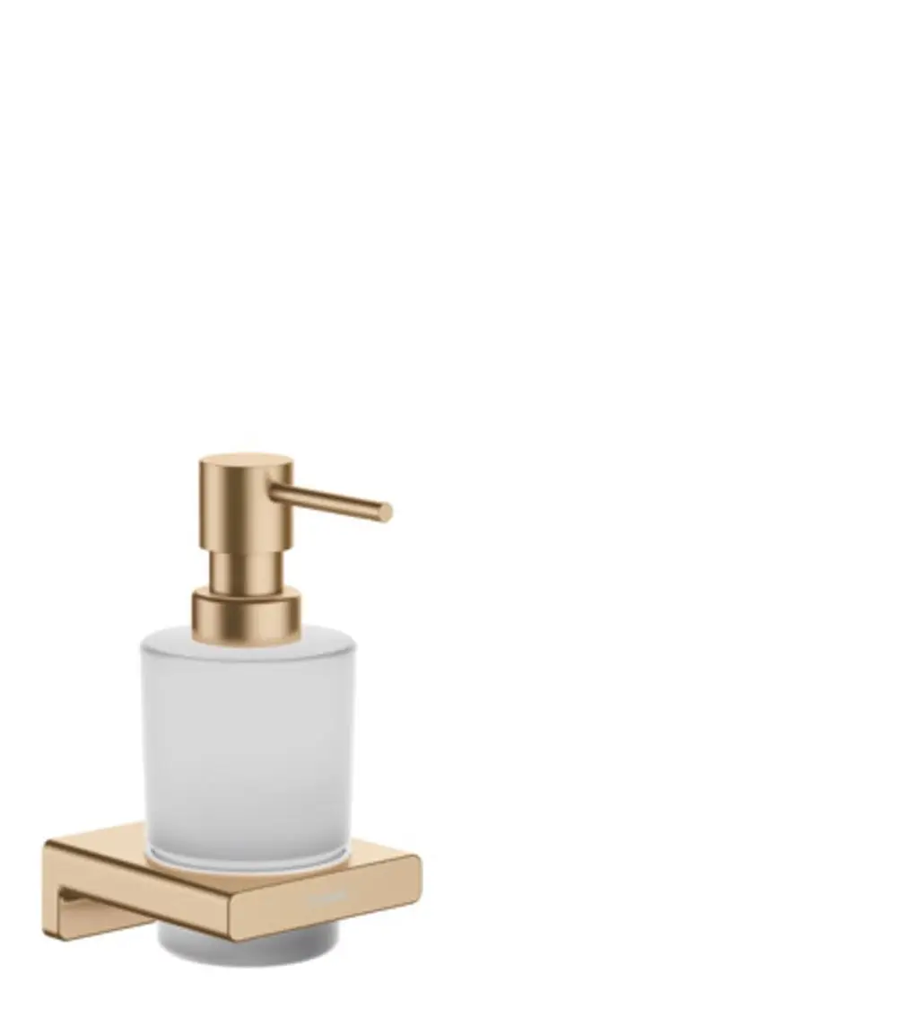 Hansgrohe Lotionspender aus klarem Glas mit einer Pumpe in Brushed Bronze, befestigt auf einer rechteckigen Halterung, die an der Wand montiert ist.